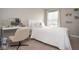 Bright bedroom with desk, stylish decor, and cozy white bedding at 4832 W Safford Dr, New Palestine, IN 46163
