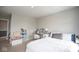 Neutral bedroom showcasing a well-lit vanity area, bed, chair, and shelving unit at 4832 W Safford Dr, New Palestine, IN 46163