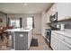 Bright kitchen with a central island, stainless steel appliances, and plenty of counter space at 4832 W Safford Dr, New Palestine, IN 46163