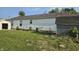 Backyard of a white home with an AC unit and a storage shed at 496 Tague St, Greenfield, IN 46140