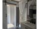 This bathroom features a sliding barn door, shower with curtain, and a modern sink and vanity at 496 Tague St, Greenfield, IN 46140