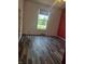 Bedroom featuring hardwood floors, natural light, and modern baseboards at 496 Tague St, Greenfield, IN 46140