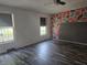 Bedroom featuring unique modern geometric wall design, hardwood floors and two windows at 496 Tague St, Greenfield, IN 46140