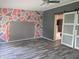 A bedroom with a unique modern style wall design and a sliding barn door at 496 Tague St, Greenfield, IN 46140
