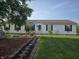Charming single-story home with a well-manicured lawn and inviting walkway at 496 Tague St, Greenfield, IN 46140