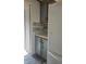 Kitchen featuring blue-and-wood cabinets, stone counters, and a white refrigerator at 496 Tague St, Greenfield, IN 46140