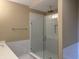 Beautiful bathroom featuring a glass shower door, modern fixtures, and white marble tiling at 4995 S 650 W, Jamestown, IN 46147