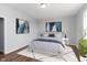 Cozy bedroom with a bright aesthetic and two navy paintings hanging above the bed at 4995 S 650 W, Jamestown, IN 46147