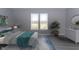 Bedroom with a window view and a queen-sized bed that is neatly decorated with throw pillows at 4995 S 650 W, Jamestown, IN 46147