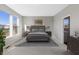 Primary bedroom featuring natural light, neutral paint and carpet, and an en suite bathroom at 4995 S 650 W, Jamestown, IN 46147