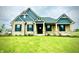 Charming single-Gathering home featuring brick and blue siding, complemented by a well-manicured green lawn at 4995 S 650 W, Jamestown, IN 46147