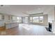 Large living room featuring bright, natural light, and an open floor plan that flows into the kitchen at 4995 S 650 W, Jamestown, IN 46147