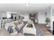 Cozy living room featuring a fireplace, hardwood floors, and plenty of natural light at 4995 S 650 W, Jamestown, IN 46147