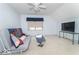 Bonus room with carpet, futon, mounted TV, and a window at 5104 W Prairiewood Dr, Muncie, IN 47304