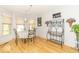 Bright dining area featuring a table, windows, and a decorative bar at 5104 W Prairiewood Dr, Muncie, IN 47304