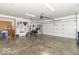 Garage features tools, two motorcycles, and two garage doors at 5104 W Prairiewood Dr, Muncie, IN 47304