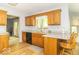 Bright kitchen with wood cabinets, black appliances and ample counter space and eat in bar at 5104 W Prairiewood Dr, Muncie, IN 47304