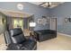 Bright and open living room featuring high ceilings and easy access to the dining area at 5104 W Prairiewood Dr, Muncie, IN 47304