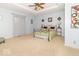 Spacious main bedroom features a trey ceiling, carpet, and decorative wall art at 5104 W Prairiewood Dr, Muncie, IN 47304
