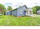 Charming home with a well-manicured lawn, blue siding and a welcoming front porch at 5203 Carrollton Ave, Indianapolis, IN 46220