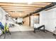 Unfinished basement area with an open ceiling and various potential uses for a workshop or gym at 5439 Maywood Dr, Whitestown, IN 46075