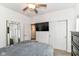 Bright bedroom with ceiling fan, closet with sliding doors, and television creating a relaxing retreat at 5439 Maywood Dr, Whitestown, IN 46075