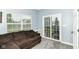 Living room featuring a sliding glass door that opens to the deck at 5439 Maywood Dr, Whitestown, IN 46075