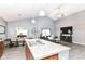 Open-concept living and dining area featuring modern decor and wood-look floors at 5439 Maywood Dr, Whitestown, IN 46075
