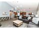 Spacious open-concept living area with vaulted ceilings, laminate floors, neutral paint and plenty of natural light at 5439 Maywood Dr, Whitestown, IN 46075