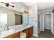 Well-lit main bathroom featuring double sinks, decorative mirrors, and a separate shower at 5439 Maywood Dr, Whitestown, IN 46075