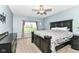 Spacious main bedroom with a ceiling fan, carpeted floor and a view of the backyard at 5439 Maywood Dr, Whitestown, IN 46075