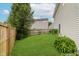 Lush backyard with grass and a wooden fence, perfect for relaxation and privacy at 565 Cembra Dr, Greenwood, IN 46143