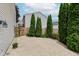 Paver patio in backyard with privacy landscaping at 565 Cembra Dr, Greenwood, IN 46143