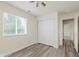 Inviting bedroom with wood-look floors, providing a closet, a window and plenty of space at 565 Cembra Dr, Greenwood, IN 46143