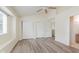 Bedroom featuring wood-look floors, a ceiling fan, and a closet, offering comfort and functionality at 565 Cembra Dr, Greenwood, IN 46143