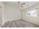 Light-filled bedroom with wood-look floors and a large window, creating a cozy retreat at 565 Cembra Dr, Greenwood, IN 46143