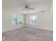 Spacious bedroom featuring neutral carpet, ample natural light, and a ceiling fan at 565 Cembra Dr, Greenwood, IN 46143