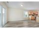 Open dining area with view of kitchen and sliding door to the backyard at 565 Cembra Dr, Greenwood, IN 46143