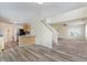 Bright living room area with stairs, dining area, modern flooring, and natural light at 565 Cembra Dr, Greenwood, IN 46143