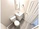 Well-lit half bath with new flooring, toilet, and single sink at 5826 Buck Rill Dr, Indianapolis, IN 46237