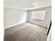 Carpeted bedroom features neutral walls and one window at 5826 Buck Rill Dr, Indianapolis, IN 46237
