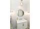 Bathroom featuring modern fixtures including sink, vanity, mirror, and sconce lighting at 6220 E 56Th St, Indianapolis, IN 46226