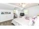Bright bedroom featuring a ceiling fan, built-in storage, and a cozy reading nook with natural light at 6220 E 56Th St, Indianapolis, IN 46226