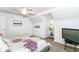 Serene bedroom with vaulted ceiling, built-in shelving, and a window seat perfect for reading or relaxing at 6220 E 56Th St, Indianapolis, IN 46226