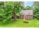 Charming brick home featuring a well-manicured lawn and classic architectural details at 6220 E 56Th St, Indianapolis, IN 46226