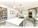 Bright kitchen with stainless appliances, central island, and a pantry with plenty of storage shelves at 6220 E 56Th St, Indianapolis, IN 46226
