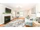 Bright living room with hardwood floors, fireplace, and comfortable seating at 6220 E 56Th St, Indianapolis, IN 46226