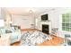 Cozy living room with hardwood floors, fireplace, and comfortable seating at 6220 E 56Th St, Indianapolis, IN 46226