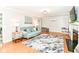 Bright living room with hardwood floors, fireplace, and comfortable seating at 6220 E 56Th St, Indianapolis, IN 46226