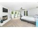 Spacious main bedroom with fireplace, plush carpet, and french doors leading to a deck at 6220 E 56Th St, Indianapolis, IN 46226